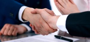 Shaking hands on a land contract